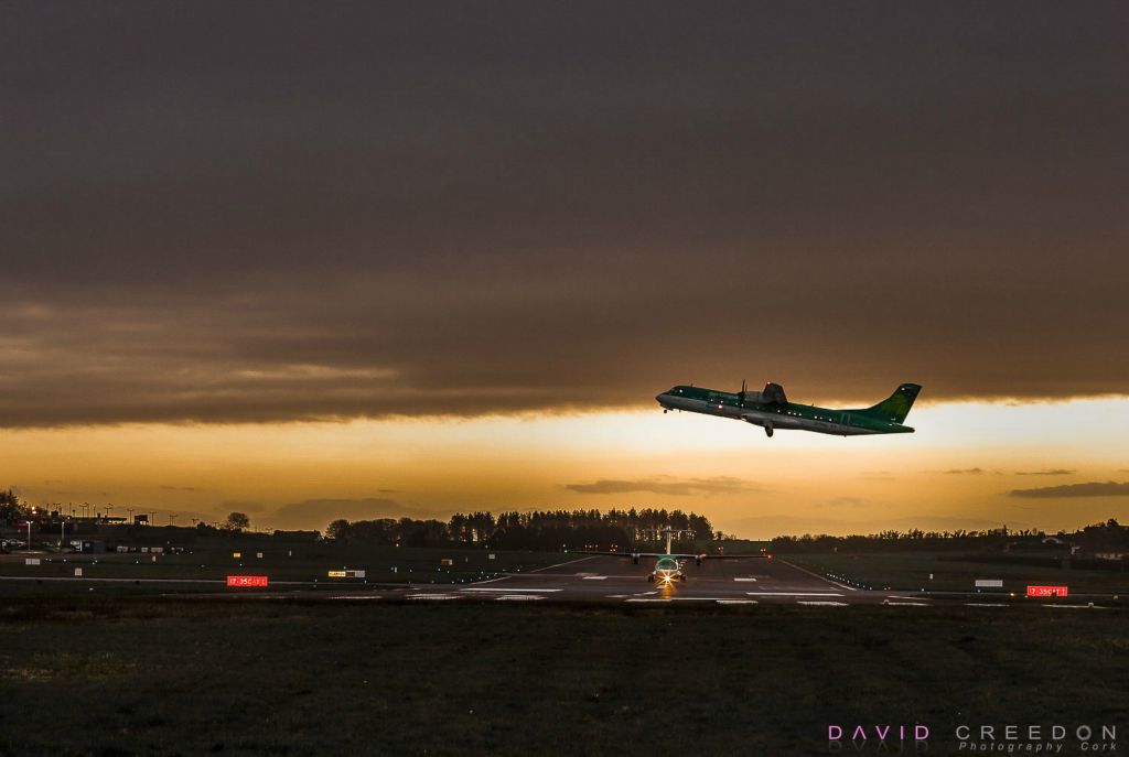 The dawn flight of an Aer Lingus regional aircraft departs for Edinburgh while the Manchester flight waits to access the runway at Cork International Airport.                                                                         