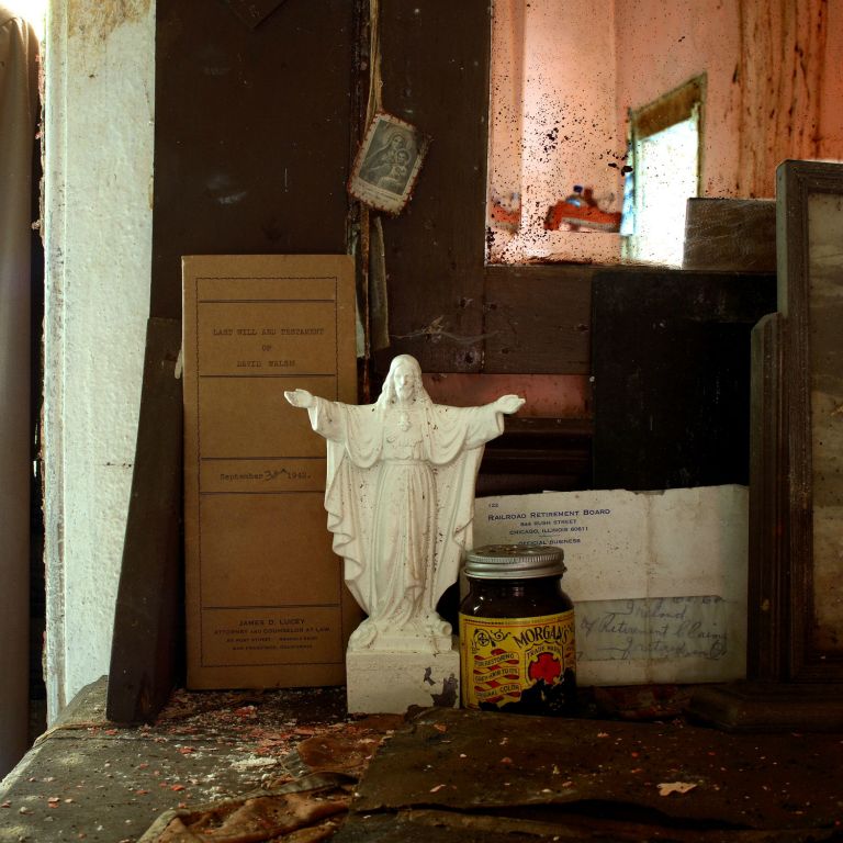  This was the last photograph taken in this series and was shot in early 2007.  The image contains a letter , a jar of Morgan’s hair colour restorer and a last will and testament. James Lucey Attorney of law in San Francisco made out the will on The 30th September 1942. The statue reminds me of the Christ the Redeemer that overlooks Rio de Janeiro. On returning   to the house some months later I found the roof had fallen in and many of the contents destroyed.I knew then, I had reached the end of this journey.