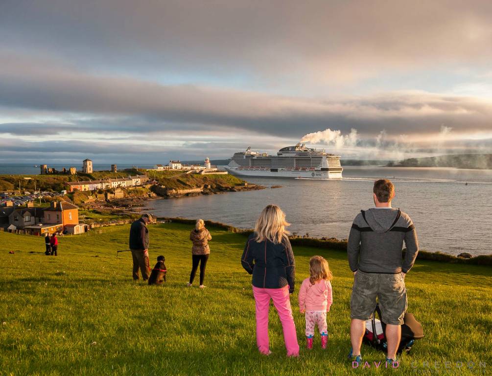 The O'Leary  family from Midleton watching the departure on a summer's evening  of the  MSC MERAVIGLIA. the largest liner ever to visit Cork at Roches Point, Co. Cork. 