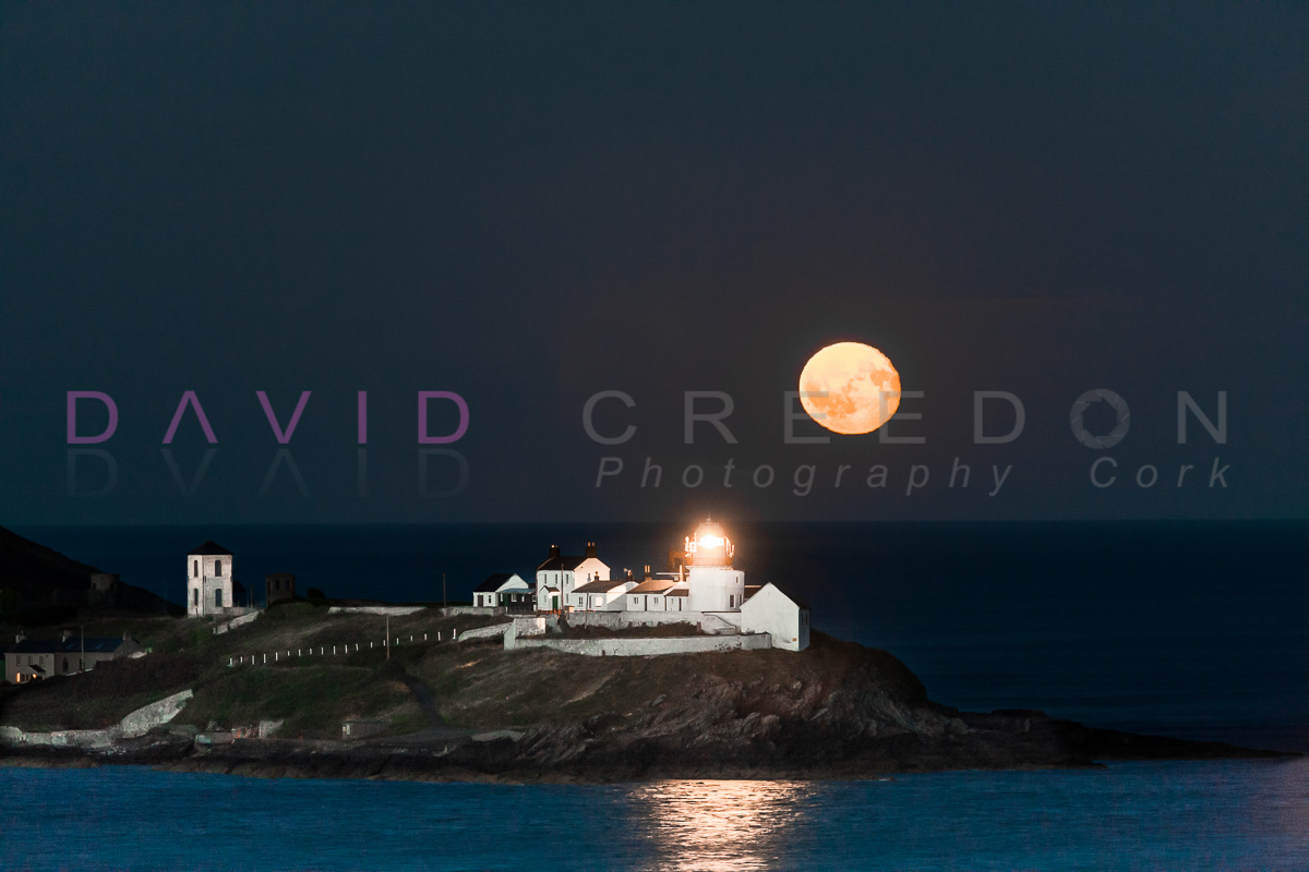 Moon rises over Roches Point
