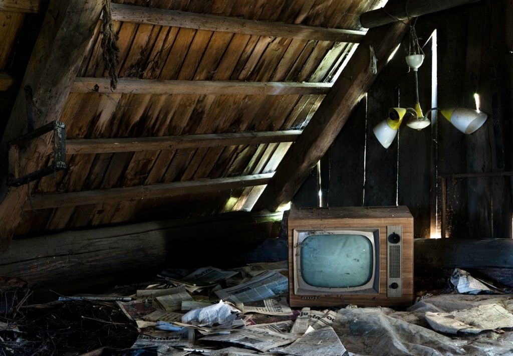 An old Television set lies in the loft of the home of Helena Girvaite.It is highly unlikely that Helena’s daughter will ever return to the land of her birth. Her mothers’ home is now a reflection of her life. In time the house will be reclaimed by nature and all that will remain will be dust.