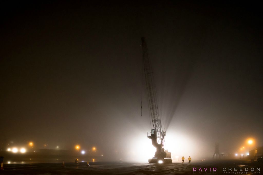  Early morning runners out for a jog on a foggy morning at the docks on Kennedy Quay in Cork City, Cork, Ireland.