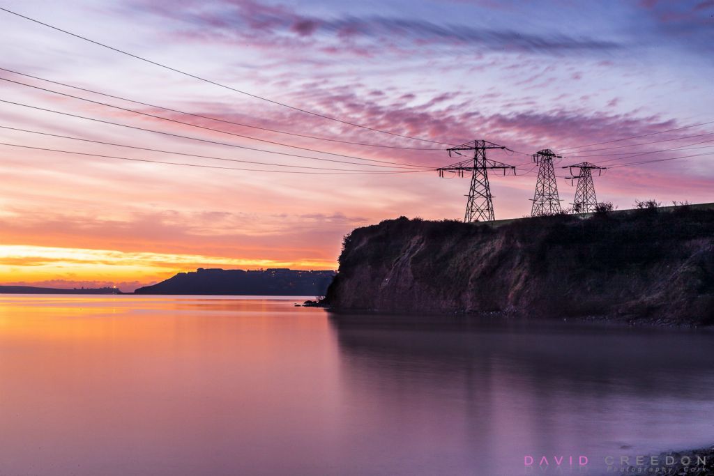 Electricity  Pylons silhouette against a dawn sky at Ringaskiddy Co. Cork.                                                                                                  