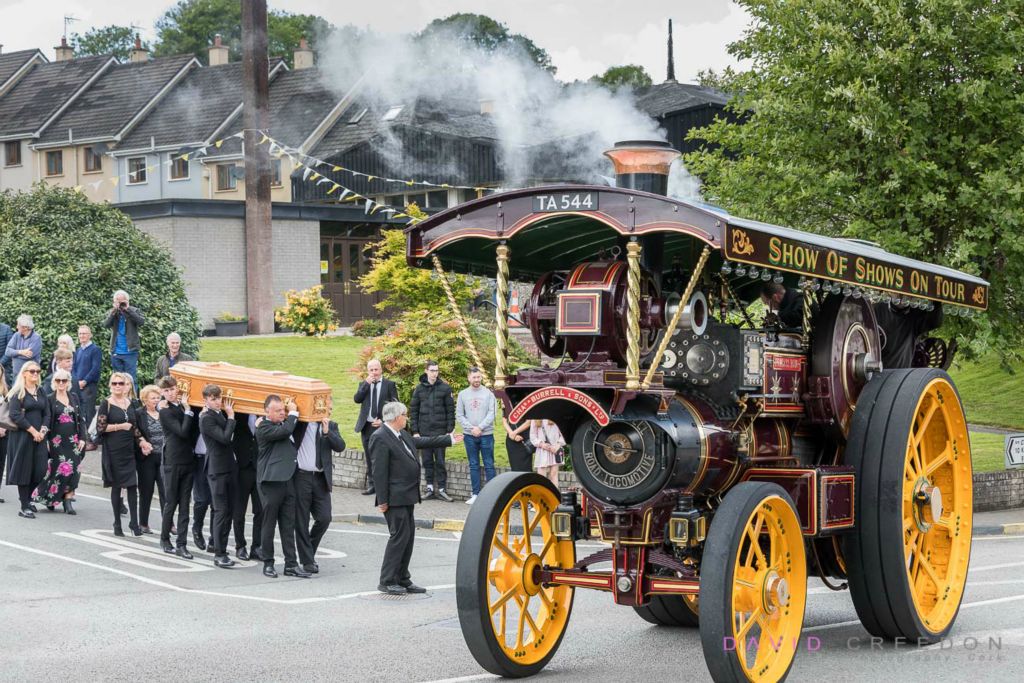 A 1911 Burrell steam engine leads a funeral cortège after Requiem Mass at St. Joseph’s Church, Riverstick, Co. Cork, Ireland. 