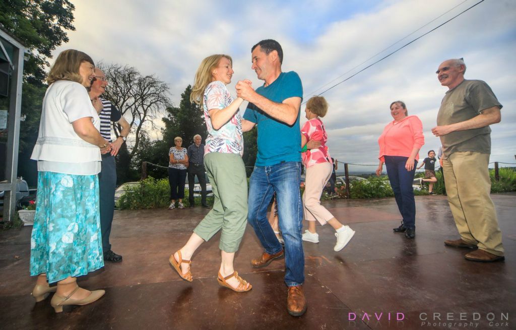 Dancing at the Crossroads: Annmarie and Martin Dennehy from Bweeng dancing a set at Laharn Cross, Co. Cork. 