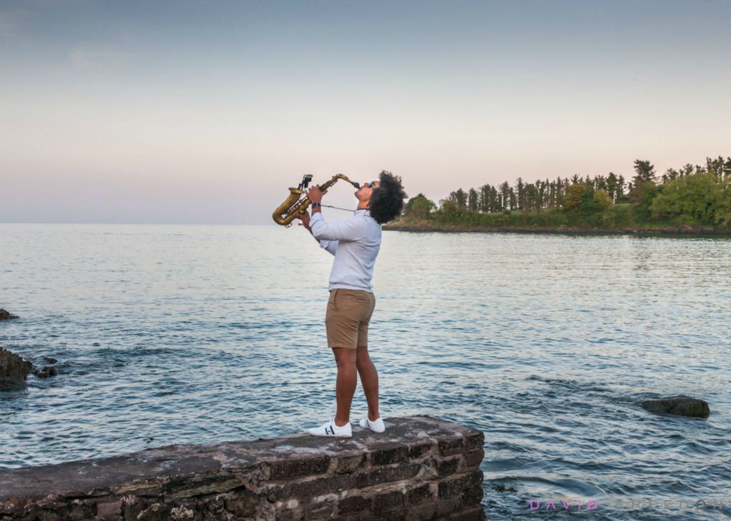 Chris Jordan-Engel plays his alto-sax on the shore in Fountainstown, Co. Cork, Ireland.