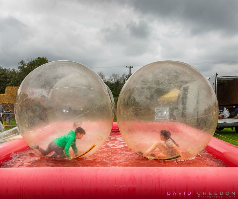 Children play in giant floating balls at the Ballygarvan Agricultural Show in Co. Cork.