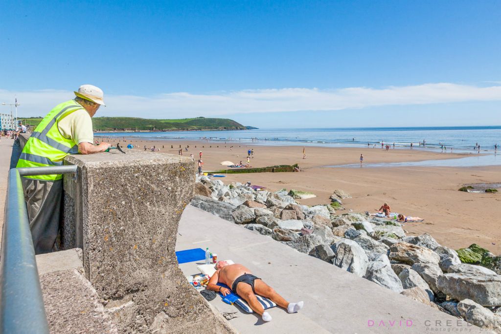 Sunbathing on the seafront in Youghal, Co. Cork, Ireland. 