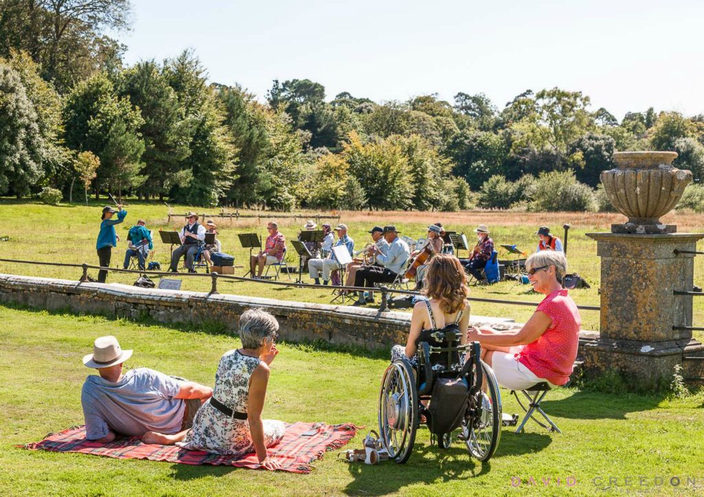 Vistors enjoying the music of the Cork Light Orchestra under the baton of Ilse de Ziah on a lovely summer's afternoon in the grounds of Fota House and gardens, Co. Cork, Ireland. 